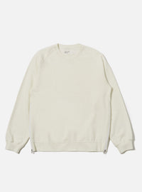 The Ecru Brush Back Sweat Billy Sweat is shown as a flat lay against a plain white background. The sweatshirt features a classic crew neckline, long sleeves with ribbed cuffs, and a ribbed hem. The fabric is a solid ecru cotton with a soft, matte finish.