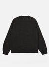 The Black Brush Back Sweat Billy Sweat is shown from the back as a flat lay against a plain white background. The sweatshirt features a simple construction with a ribbed crew neck, ribbed cuffs, and a ribbed hem. The black cotton fabric has a soft, matte finish characteristic of brush-back sweat material.
