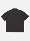 The Black Tech Cotton S/S Dwight Overshirt is shown from the back as a flat lay against a plain white background. The image highlights the garment's clean back panel, short sleeves, and straight hem.