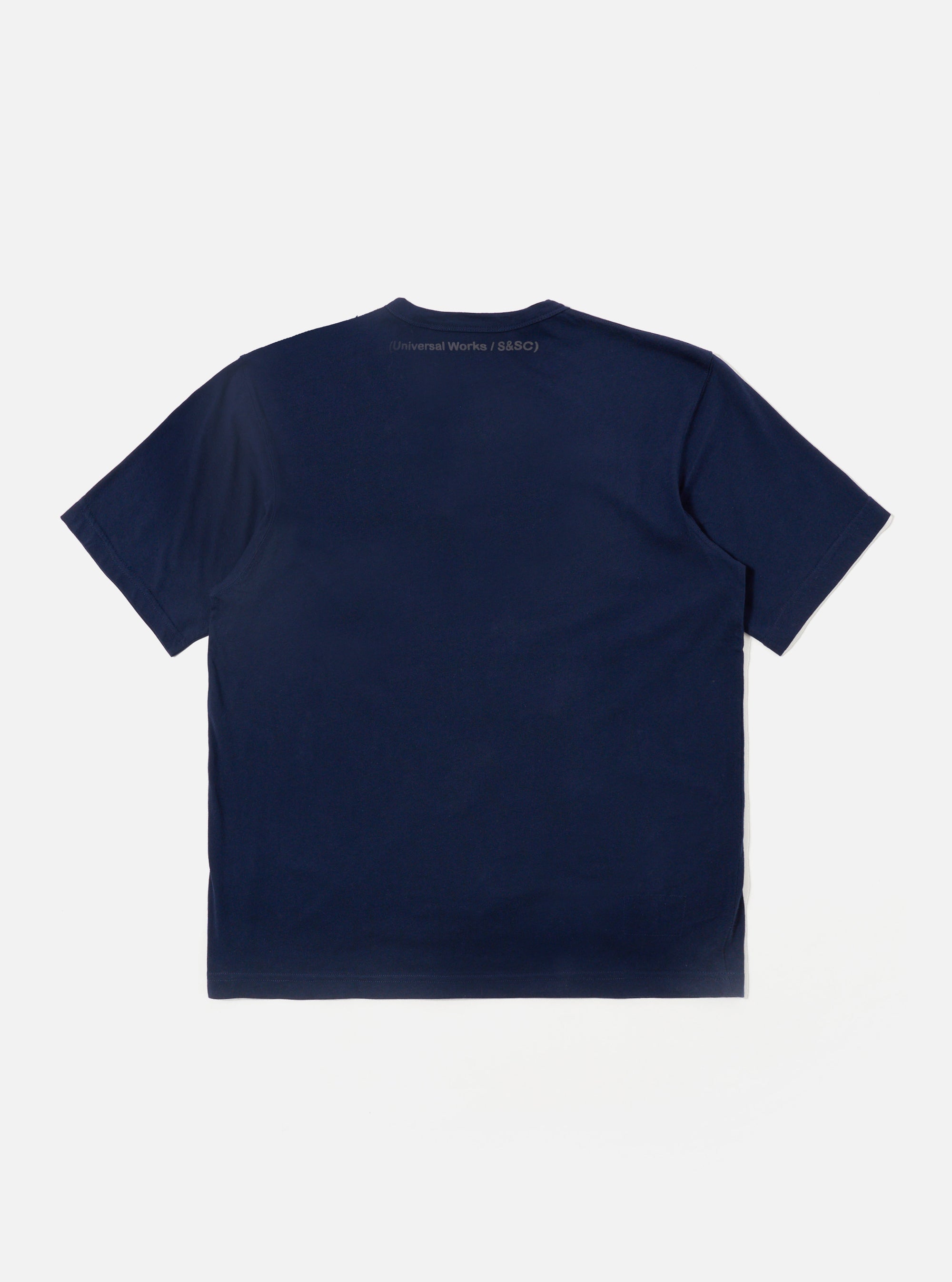 The Navy Single Jersey 34 Printed Core Tee is shown from the back as a flat lay against a plain white background. The t-shirt features a classic short-sleeve design with a ribbed crew neck and a straight hem. The garment is made from a solid navy blue cotton jersey with a smooth finish.