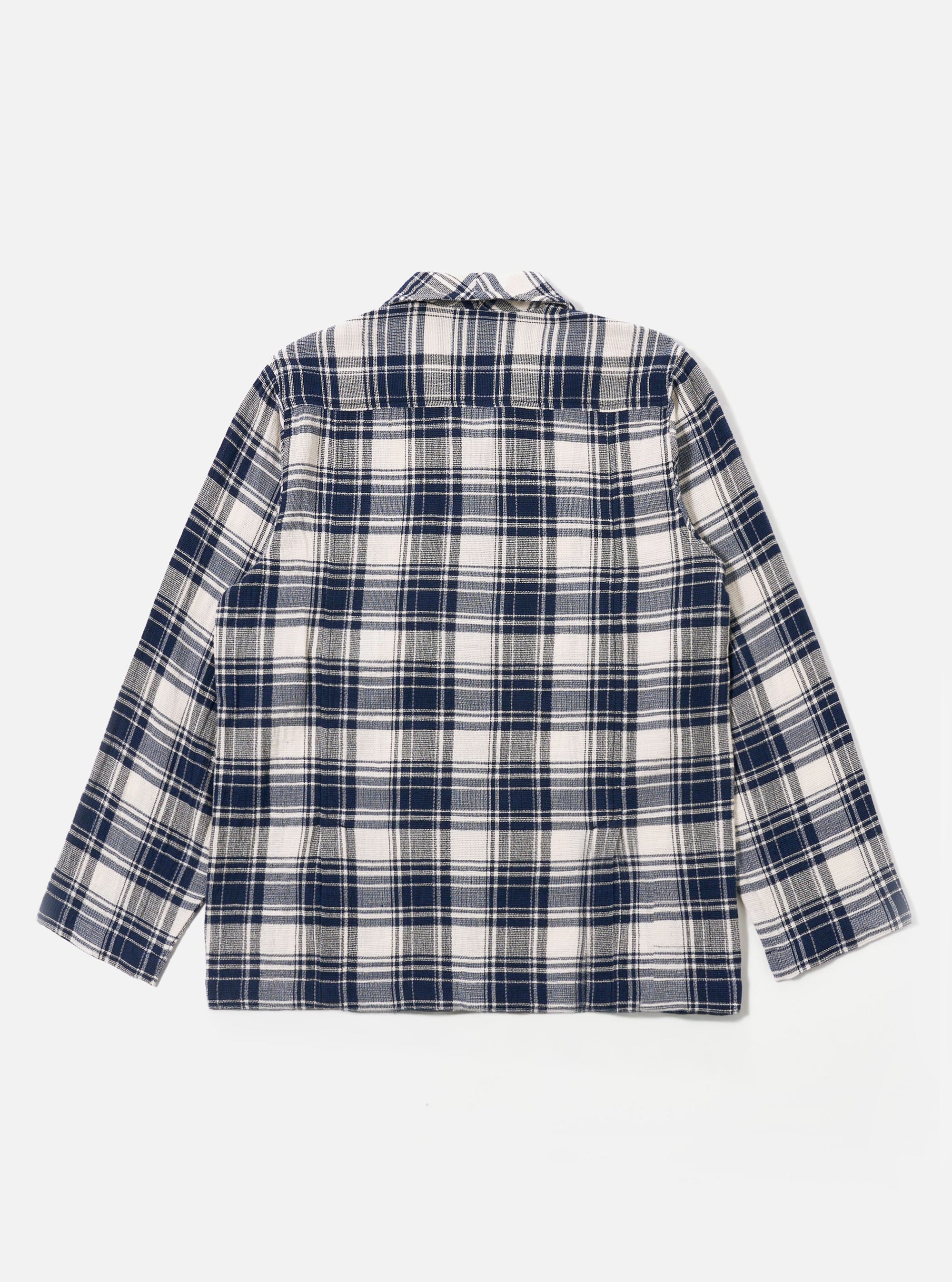 The Navy Texture Plaid Cancun Jacket is shown from the back as a flat lay against a plain white background. The jacket features a textured navy plaid pattern, a straight hem, and double back vents.