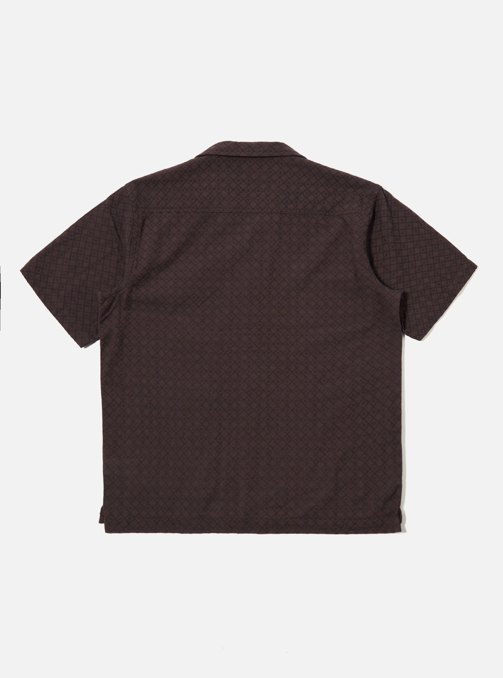 The Brown Diamond Dobby Deck Shirt is shown from the back as a flat lay against a plain white background. The shirt features a simple back panel with a straight hem and a classic collar. The fabric has a distinct diamond-shaped dobby weave texture throughout.