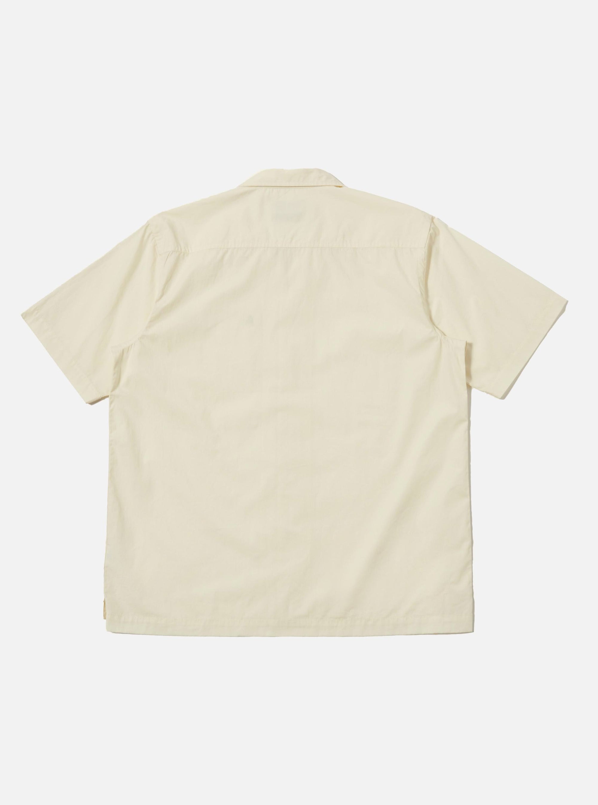 Back view of the A. SOCIETY x Universal Works Ecru Broadcloth Camp Shirt. The shirt is ecru-colored, short-sleeved, and made of broadcloth. Shot against a white backdrop.