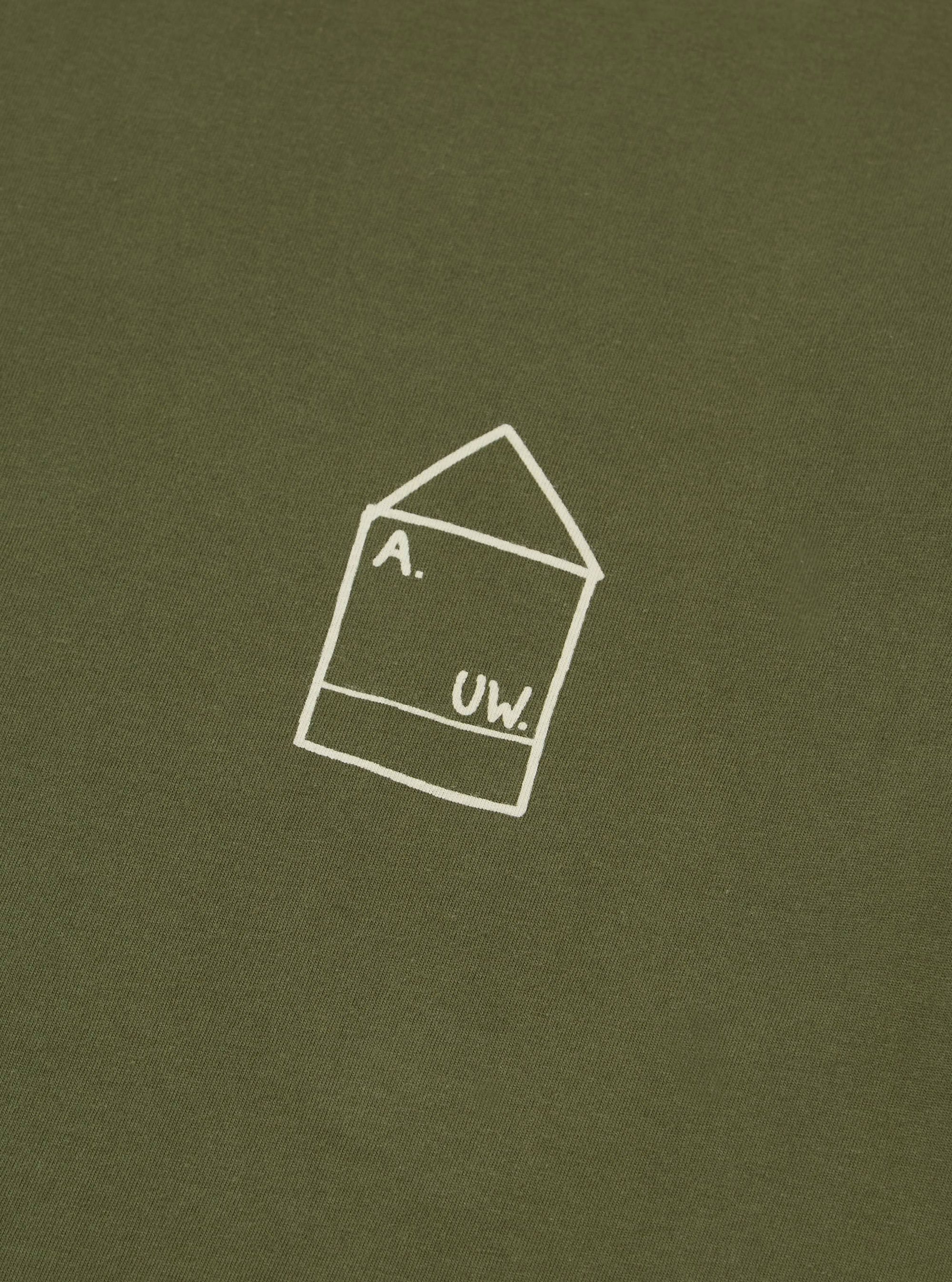 Close-up of the A. SOCIETY x Universal Works Olive Single Jersey Print Tee. The olive tee features a white graphic print. Soft, single jersey material.