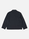 The Navy Twill Franck Jacket is shown from the back as a flat lay against a plain white background. The image highlights the jacket's simple, clean construction, featuring a straight hem and a central vertical seam. The navy blue cotton twill fabric has a smooth, durable appearance.