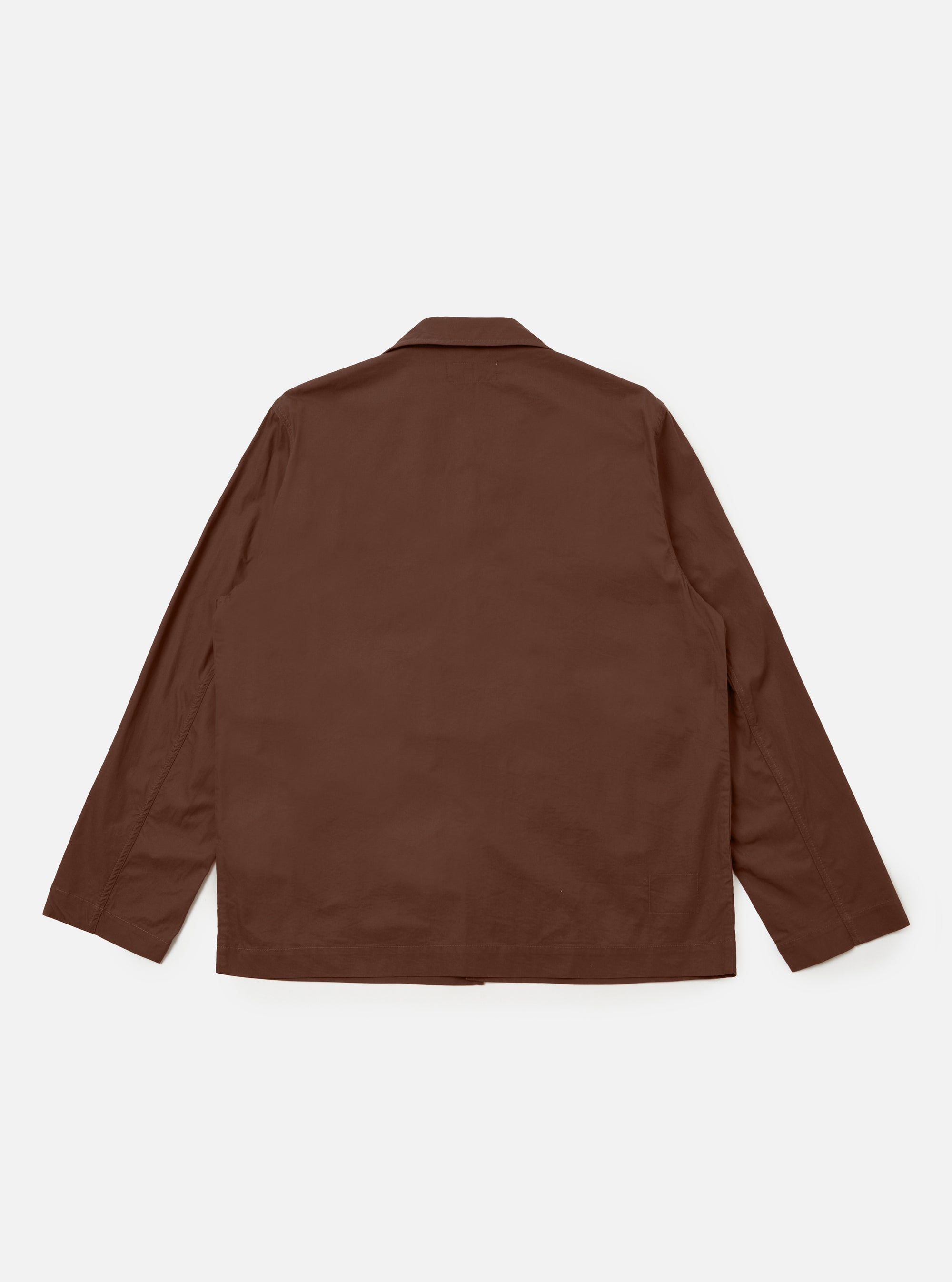 The Brown Peached Poplin Franck Jacket is shown from the back as a flat lay against a plain white background. The image highlights the smooth, matte texture of the brown fabric and the clean, simple construction of the garment's rear panel.