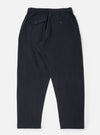 The Dark Navy Ospina Cotton Pleated Track Pant is shown from the rear as a flat lay against a plain white background. The image highlights the elasticated waistband and the rear patch pockets. The dark navy fabric features a visible puckered seersucker texture.