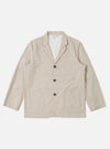 The Brown Kennedy Stripe Three Button Jacket is presented as a flat lay against a plain white background. The jacket features a classic three-button front closure, a notched lapel, and three front patch pockets, including one at the chest and two at the waist. The fabric is a brown cotton with a visible vertical stripe pattern.