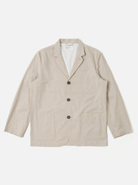 The Brown Kennedy Stripe Three Button Jacket is presented as a flat lay against a plain white background. The jacket features a classic three-button front closure, a notched lapel, and three front patch pockets, including one at the chest and two at the waist. The fabric is a brown cotton with a visible vertical stripe pattern.