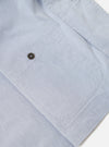 The Navy Kennedy Stripe Three Button Jacket is shown in a detail view as a flat lay against a plain white background. The image focuses on the interior construction of the jacket, highlighting the unlined back, clean internal seams, and a single chest pocket. The navy blue cotton fabric features a subtle vertical Kennedy stripe pattern throughout.