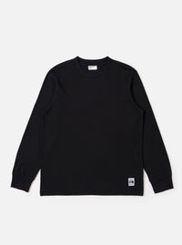 The Black Recycled/Bio Jersey Henry L/S Tee is presented as a flat lay against a plain white background. This long-sleeve t-shirt features a crew neckline, ribbed cuffs, and a straight hem. The garment is made from a solid black recycled and organic cotton jersey fabric.