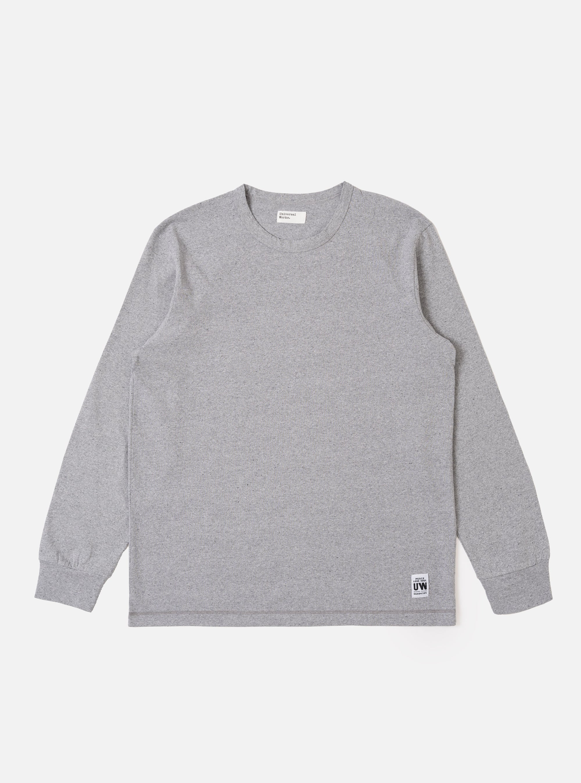 The Grey Marl Recycled/Bio Jersey Henry L/S Tee is shown as a flat lay against a white background. The long-sleeved T-shirt features a crew neckline, a straight hem, and a single patch pocket on the left chest. The fabric is a light grey marl jersey with a soft, textured appearance.