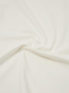 A close-up swatch image of the Antique White Recycled/Bio Jersey Henry L/S Tee fabric displays a soft, off-white antique white color. The image focuses on the fine, smooth knit texture of the recycled and organic cotton jersey material.