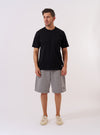 The Black Recycled/Bio Jersey Core Pocket Tee is shown as a flat lay against a plain white background. The T-shirt features a crew neck, short sleeves, and a single patch pocket on the left chest. The black fabric is a smooth jersey with a matte finish.