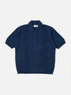 The Dark Navy Cotton Lace Knit Jonny Knit Shirt is shown as a flat lay against a white background. The shirt features a full-button front, a classic pointed collar, and short sleeves. The garment is characterized by its intricate, open-work lace knit texture in a deep navy blue.