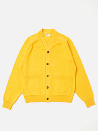 The Yellow Eco Cotton Knit Pocket David Cardigan is shown as a flat lay against a white background. The cardigan features a V-neckline, a five-button front closure, and two large patch pockets at the waist. The knit fabric has a textured, ribbed appearance in a vibrant yellow ochre color with tonal binding along the edges.