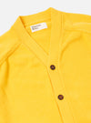 The Yellow Eco Cotton Knit Pocket David Cardigan is shown from the back as a flat lay against a plain white background. The image highlights the textured knit of the yellow recycled cotton fabric and the simple, straight-cut construction of the garment's rear.