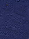 The Navy Fine Texture Tricot S/S Knit Polo is shown from the back as a flat lay against a plain white background. The image highlights the garment's loose, oversized fit and the intricate raised textured rib pattern of the navy cotton fabric. The short sleeves and straight hem are clearly visible.