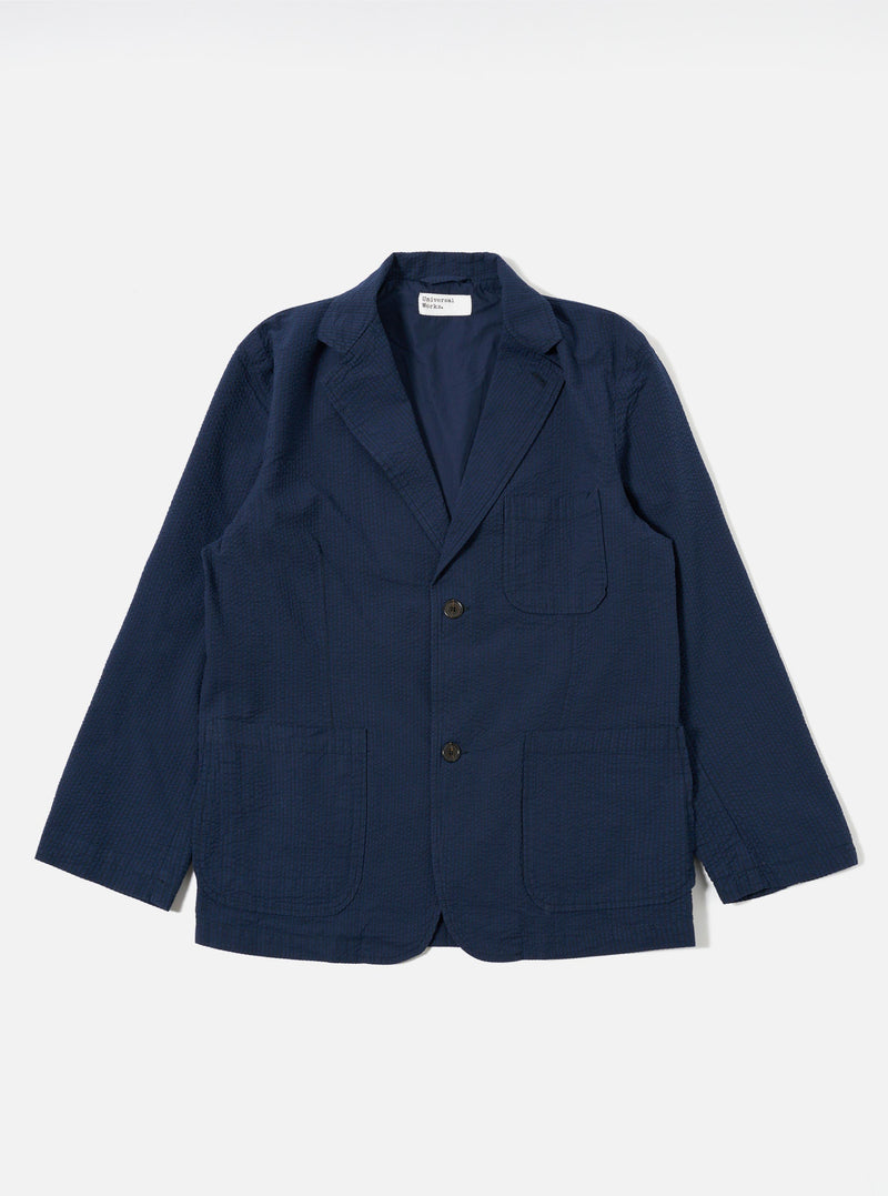 The Navy Derby Stripe Two Button Jacket is displayed as a flat lay against a white background. The jacket features notched lapels, a two-button front closure, and two large patch pockets at the waist. The fabric has a distinct navy and white vertical stripe pattern throughout.