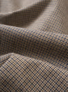 The Multi Lucas Cotton Mix Two Button Jacket is shown in a detail view as a flat lay against a plain white background. The image focuses on the multi-colored check pattern and the textured cotton-linen-acrylic blend fabric. The garment features a longer, wider lapel and visible stitching on the chest patch pocket.