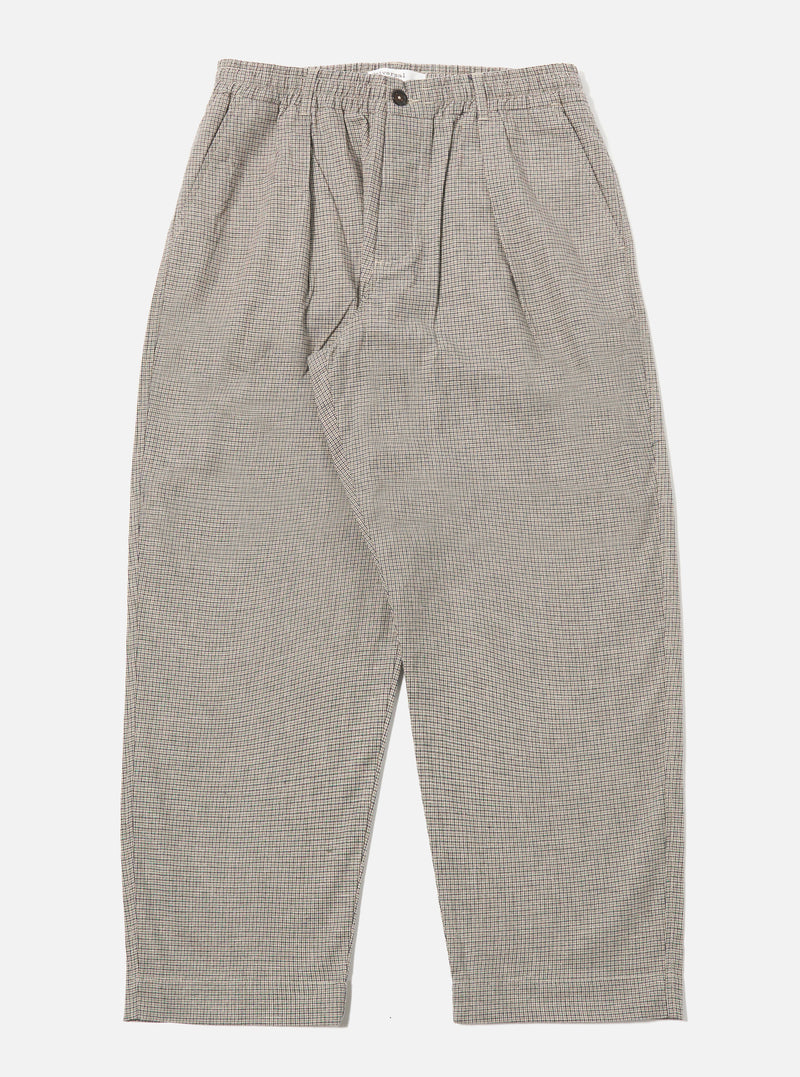 The Multi Lucas Cotton Mix Oxford Pant is shown as a flat lay against a white background. The trousers feature a wide, loose leg with a single pleat front, an elasticated drawstring waistband, and two side pockets. The fabric is a mid-weight cotton mix with a small three-color houndstooth check pattern.
