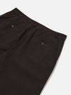 The Licorice Summer Canvas Military Chino is shown in a detail view as a flat lay against a plain white background. The image highlights the textured finish of the dark brown licorice-colored summer canvas fabric and the construction of the waistband and front pockets.