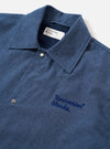 The Blue Sintra Recycled Cotton Head Coach Jacket is displayed as a flat lay against a plain white background. The jacket features a relaxed, boxy fit with a central two-way zip closure and a classic shirt-style collar. Two prominent patch pockets with buttoned flaps are positioned on the chest, accompanied by two slanted handwarmer pockets at the waist. The garment is constructed from a solid blue recycled cotton fabric with a visible weave.