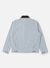 The Light Indigo Jean Cloth Reworked Rose Bowl Jacket is shown from the back as a flat lay against a plain white background. The image highlights the boxy fit, the slightly oversized collar, and the adjustable back hem with buttoned tabs. The light indigo organic cotton fabric features a subtle textured finish.
