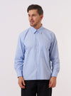 A model wears the Blue Mc Stripe Square Pocket Shirt against a plain, light grey background. The shirt features a blue and white vertical stripe pattern, a classic button-down front, a structured collar, and two large square patch pockets at the chest. The model is shown from a front-facing angle, wearing the shirt buttoned up with the sleeves down.