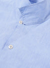 The Sky Blue Sido Linen Mix Road Shirt is shown from a rear three-quarter angle as a flat lay against a plain white background. The image highlights the straight hem, short sleeves, and the lightweight, textured linen-blend fabric in a pale sky blue.