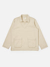 The Ecru Koko Cotlin Smock Overshirt is shown as a flat lay against a white background. The garment features a partial button-down front shown in an open position, a structured collar, and a chest patch pocket. The overshirt is made from a textured ecru cotton-linen fabric.