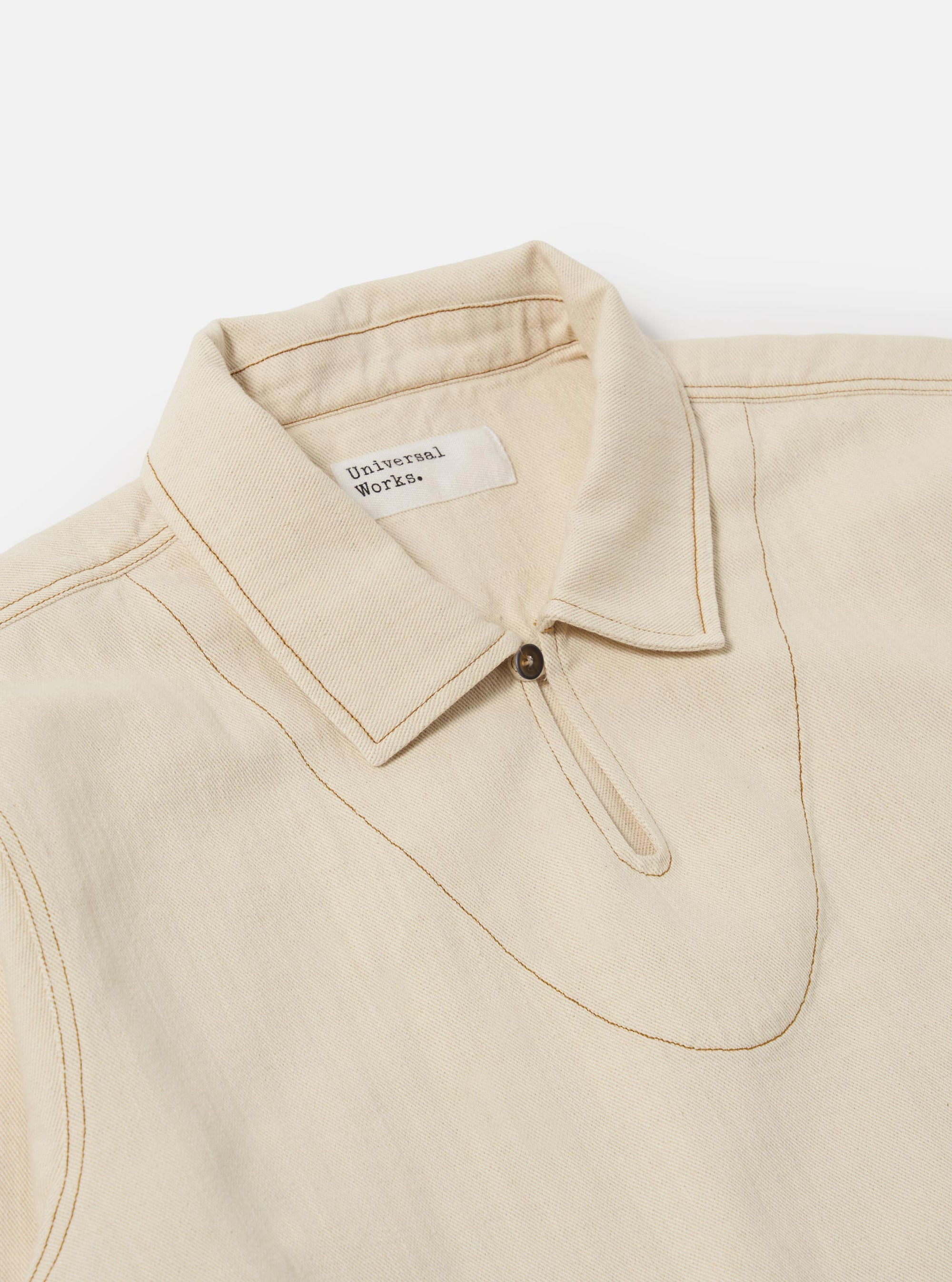 The Ecru Koko Cotlin Smock Overshirt is shown from the back as a flat lay against a plain white background. The image highlights the clean, simple construction of the rear panel, the straight hem, and the textured appearance of the ecru cotton-linen fabric.