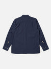 The Navy Seersucker Shirting Lucky Shirt is shown from the back as a flat lay against a plain white background. The image highlights the shirt's relaxed fit, straight hem, and the subtle puckered texture of the navy blue seersucker fabric. A simple back yoke and clean stitching along the hem and sleeves are visible.