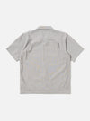 The Grey Izumi Cotton S/S Fatigue Shirt is shown from the back as a flat lay against a plain white background. The image highlights the shirt's straight hem, short sleeves, and the textured, slubby character of the grey cotton-linen fabric.