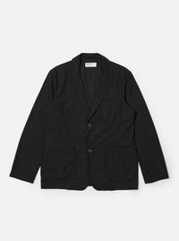 The Black Valencia Cotton Two Button Jacket is shown as a flat lay against a white background. The jacket features a classic notched lapel, a two-button front closure, and three patch pockets, including one at the chest and two larger pockets at the waist. The black cotton-blend fabric has a smooth, clean finish.