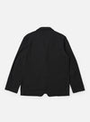 The Black Valencia Cotton Two Button Jacket is shown from the back as a flat lay against a plain white background. The image highlights the clean, structured rear of the jacket, showcasing the smooth black fabric and a single central vent at the hem.