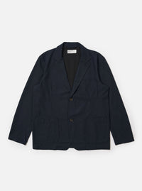 The Navy Valencia Cotton Two Button Jacket is displayed as a flat lay against a plain white background. The jacket features notched lapels, a two-button front closure, and two large patch pockets at the waist. The dark navy fabric has a smooth, structured appearance.
