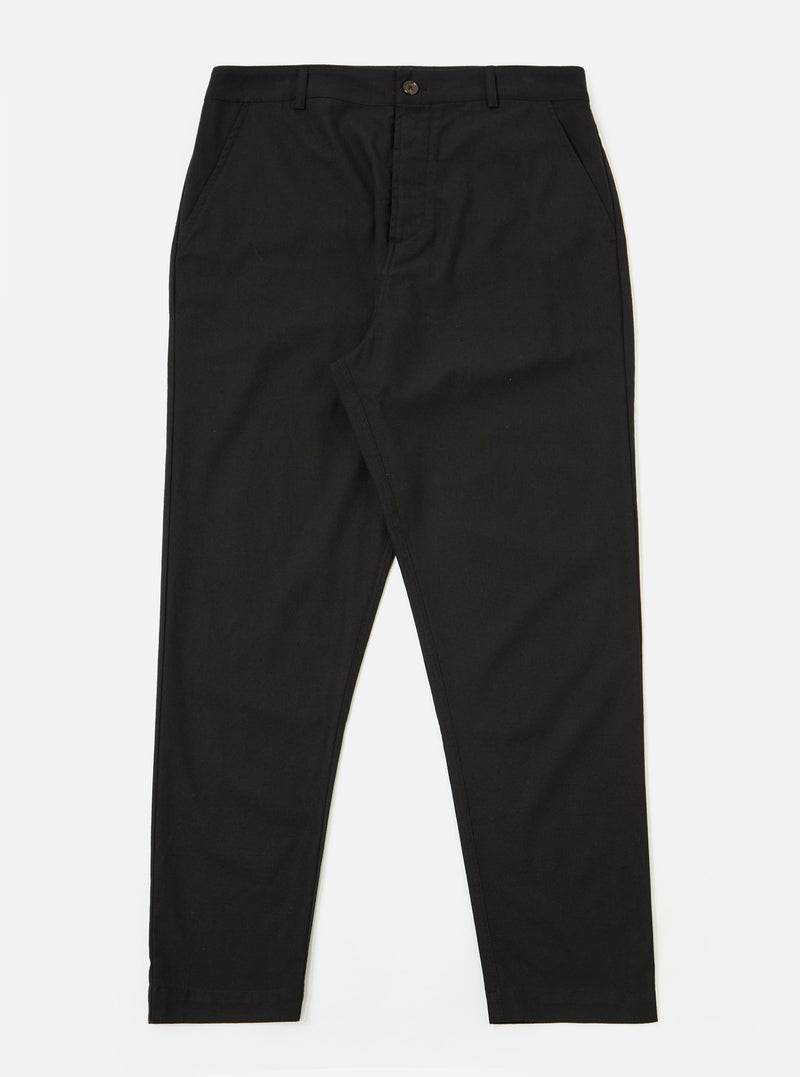 The Black Valencia Cotton Military Chino is presented as a flat lay against a plain white background. The trousers feature a button fly, two front slash pockets, and a straight-leg cut. The black fabric has a subtle textured appearance.