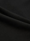 A close-up fabric swatch of the Black Valencia Cotton Military Chino displays the solid black color and the fine, woven texture of the Valencia cotton blend. The material fills the entire frame, providing a detailed view of the fabric's surface.