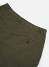 The Olive Merida Seersucker Military Chino is shown from a rear angle as a flat lay against a plain white background. The image highlights the two rear pockets, including one with a button-down flap, and the textured olive green seersucker fabric. The waistband and the tapered cut of the legs are visible.