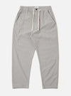 The Grey Izumi Cotton Hi Water Trouser is shown as a flat lay against a white background. The trousers feature a relaxed fit, a cropped length, and a drawstring waist with a visible white cord. The grey cotton fabric has a subtle, textured appearance.