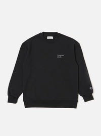 The Black Recycled Cotton Blend Jersey Loose Sweatshirt is shown as a flat lay against a plain white background. The sweatshirt features a classic crew neckline, long sleeves with ribbed cuffs, and a ribbed hem. The garment has a relaxed, loose fit and is made from a smooth black jersey fabric.
