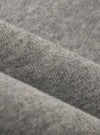 A close-up fabric swatch of the Grey Marl Recycled Cotton Blend Jersey Loose Sweatshirt displays a light grey heathered texture. The image focuses on the soft, knit quality of the recycled cotton blend material, which fills the entire frame.