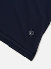 The Bright Navy Piquet Vacation Polo is shown as a flat lay against a white background. The polo features a one-piece open collar, a single chest patch pocket, and short sleeves. The piquet fabric has a subtle textured weave.
