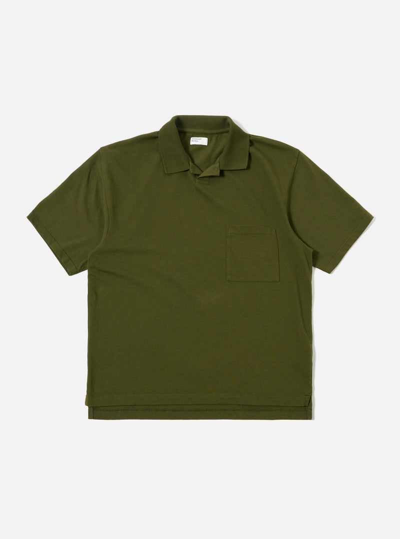The Olive Rugby Jersey Oversized Vacation Polo is shown as a flat lay against a white background. The garment features an oversized fit, a one-piece collar, a short buttonless placket, and a single patch pocket on the left chest. The short sleeves and stepped hem with small side vents are prominent.