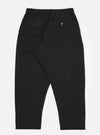 The Black Merida Seersucker Pleated Track Pant is shown from the back as a flat lay against a plain white background. The image highlights the elasticated waistband and two rear pockets, including one with a buttoned flap and one buttoned jetted pocket. The black cotton seersucker fabric has a visible puckered texture.