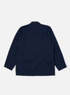 The Indigo Recycled Herringbone Kyoto Work Jacket is shown from the back as a flat lay against a plain white background. The image highlights the jacket's simple rear construction, straight hem, and the textured indigo herringbone fabric.