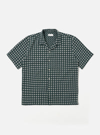 The Green/White Rhodes 8 Cotton Road Shirt is shown as a flat lay against a white background. The shirt features an all-over vertical stripe pattern in green and white, a camp collar, a central button-down closure, and two large chest patch pockets. The fabric has a visible textured weave.