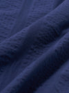 A close-up fabric swatch of the Blue Maui Cotton Road Shirt. The image shows a detailed view of the light blue and white vertical striped cotton fabric, highlighting its fine weave and textured appearance.