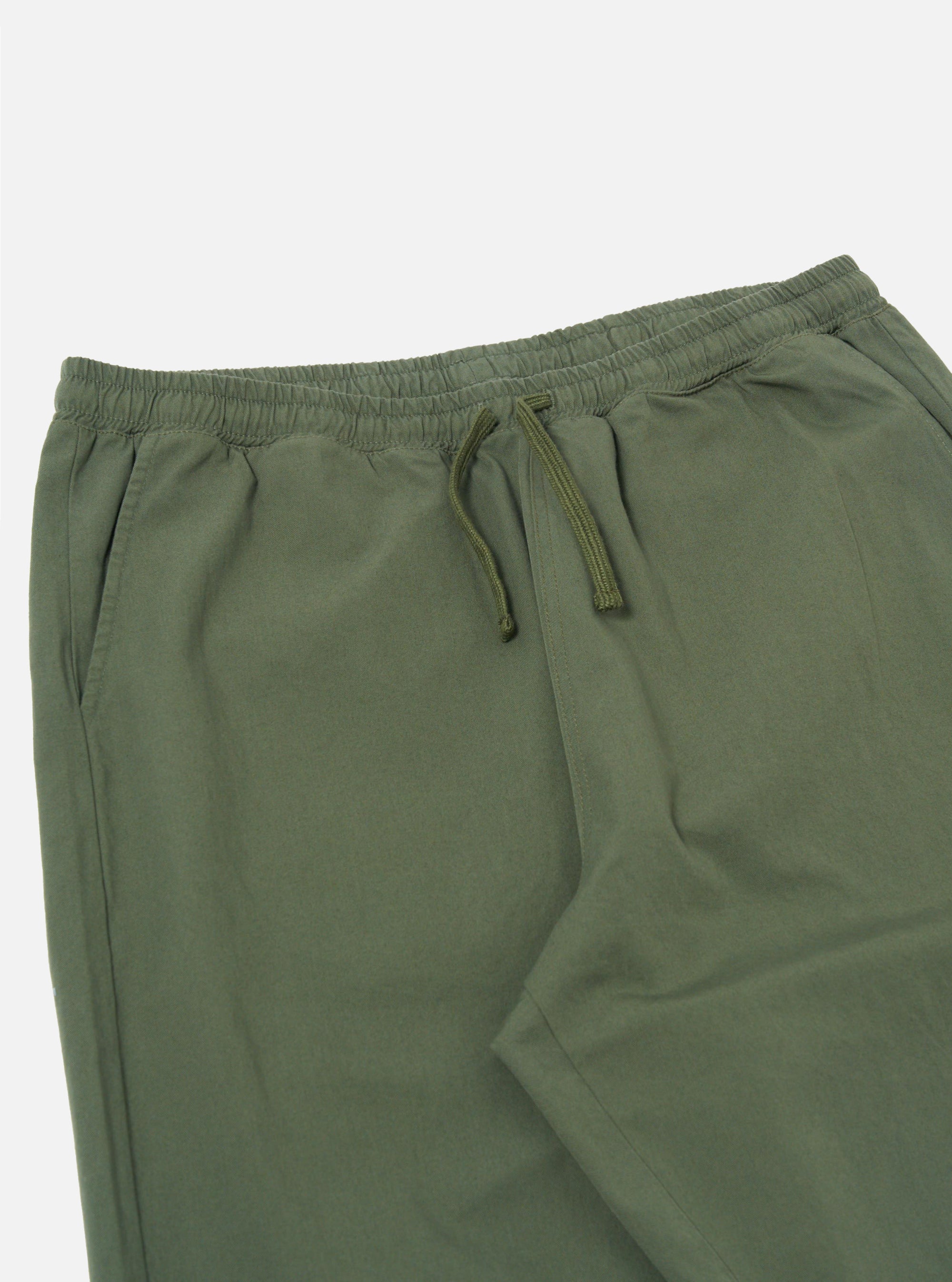 The Olive Kelly Cotton Judo Pant is shown from a rear angle as a flat lay against a plain white background. The image highlights the two back patch pockets and the elasticated waistband with a hanging loop detail. The olive green cotton fabric features a smooth, durable finish.